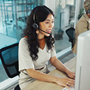 Customer service agent with headset assisting flight change